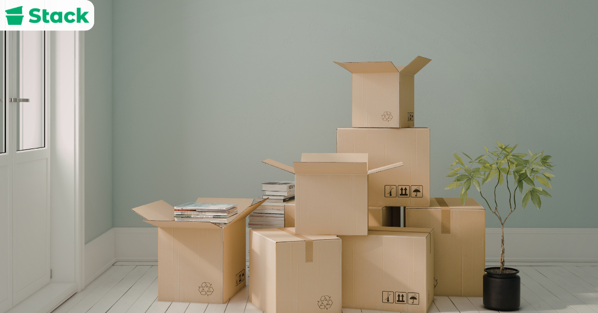 Stacked labeled cardboard moving boxes in a moving truck