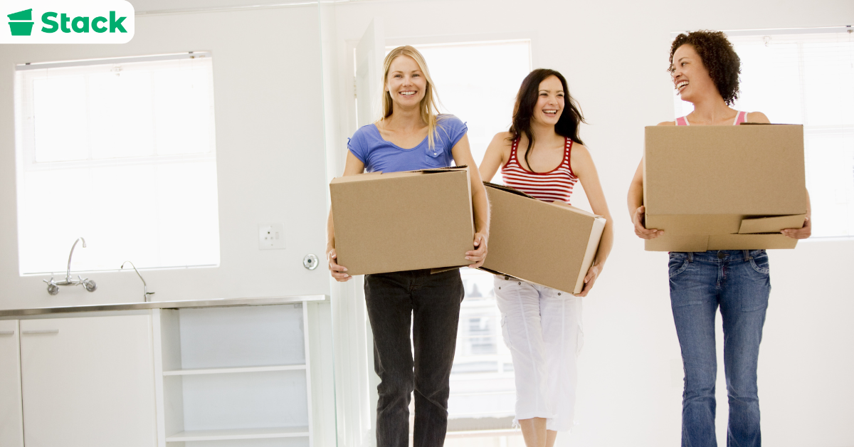 Friends sharing boxes as an example of where can you get free moving boxes