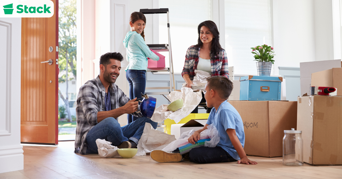 Family organizing belongings while following a list for moving out