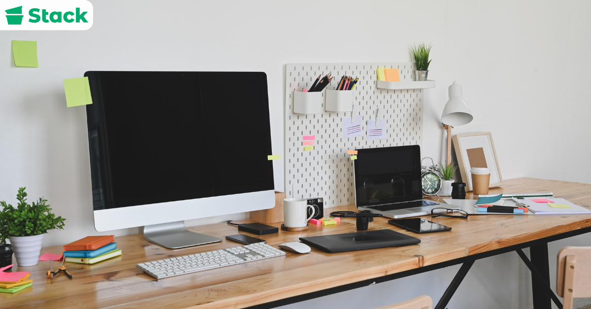 dorm room essentials for guys including desk, laptop, and study supplies
